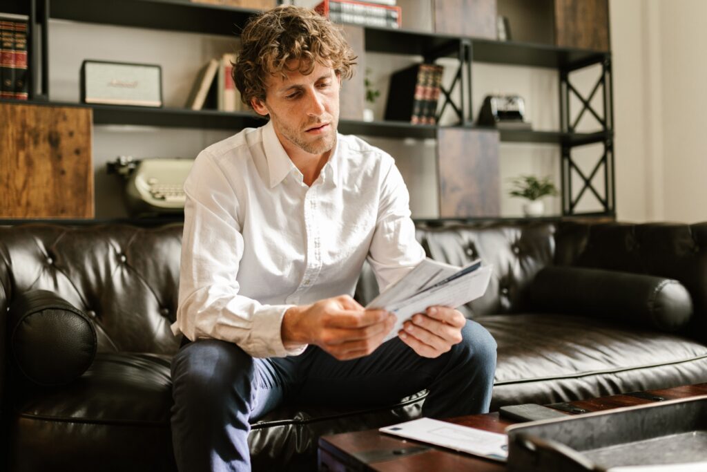 man looking at mail